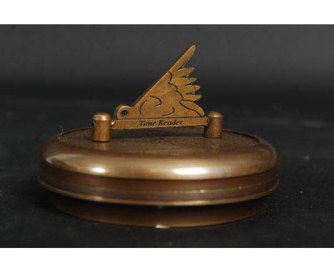 A brass cased compass and sundial