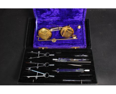 Two cased sets, one being a draughtsman's / mathematicians compass set, the other a set of gold weighing scales