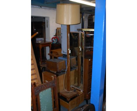 A 1930's Art Deco standard lamp having shaped base with angular upright with electrics atop