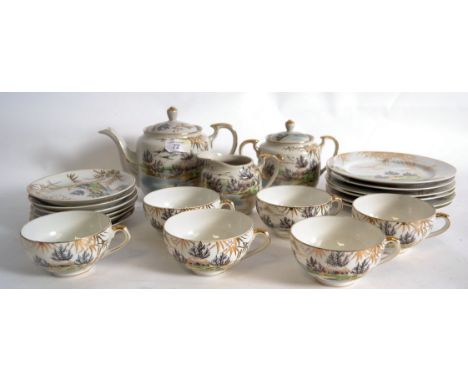 A Japanese early 20th century export ware translucent tea service comprising, cups, saucers, plates etc all with mountain sce