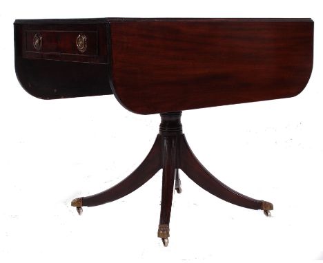 A 19th century Georgian mahogany sofa table. Raised on a reeded quadruped base with brass castors having drop leaves with the