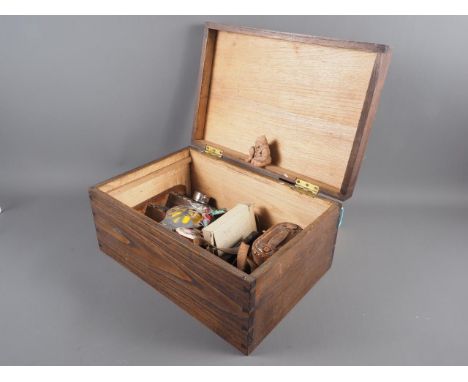 An assortment of items, including binoculars, two AA badges, a miniature model miner's lamps, a set of miniature books and ot