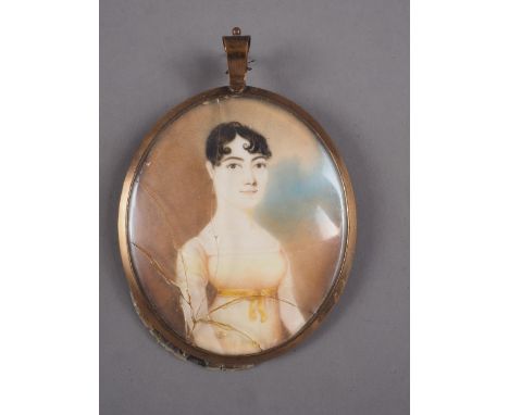 A Regency portrait miniature on ivory of an unknown woman, in yellow metal frame, with woven hair and monogram verso, 3 3/8" 