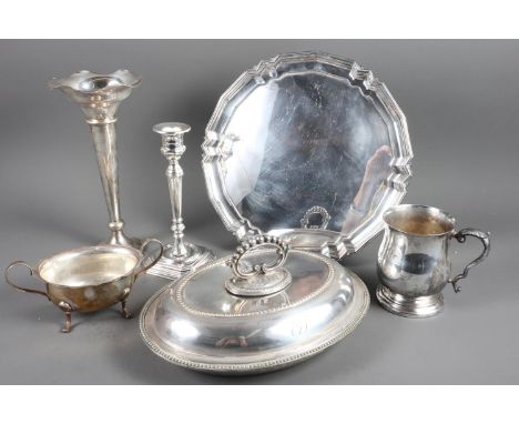 A quantity of silver plate, including entree dishes, a candlestick, trays, sauce boats and other items