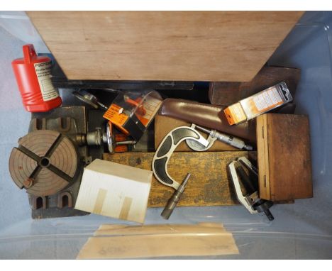 A collection of precision engineering tools, including Mitutoyo callipers, other measuring gauges, vernier gauges, etc