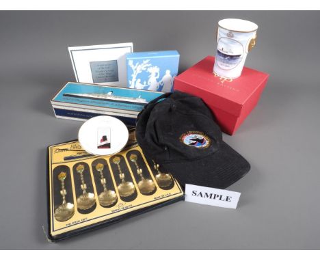 A large collection of Cunard Queen Elizabeth cruise ship ephemera and collectables, including ceramics, luggage tags, pin bad