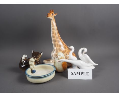A porcelain model giraffe, 12” high, three Lladro model geese, a Danish dish with circus bear, a Russian model of a bear and 