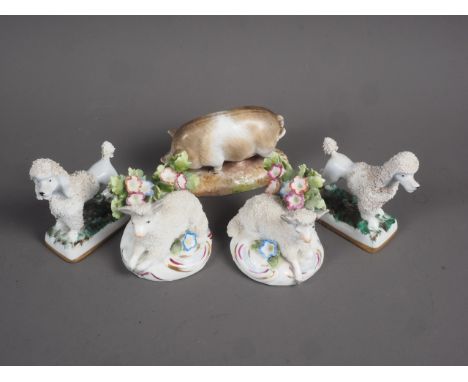 A Continental model pig, 2 1/4” high, a pair of English bone china poodles and a similar pair of sheep