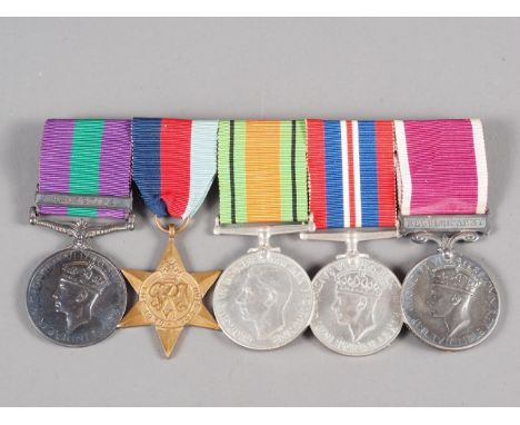 A group of five WWII medals, comprising The General Service Medal with Palestine bar awarded to 7580376 W.O. CL.1 H. Gordon R