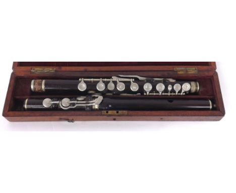 Rosewood flute circa 1850 by and stamped H. Journet, 43 Tottenham Court Road, with block mounted nickel keys and joint mounts