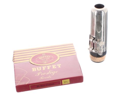 Bass clarinet mouthpiece with ligature and cap; also with a box of Buffet Prestige reeds, strength 2 1/2