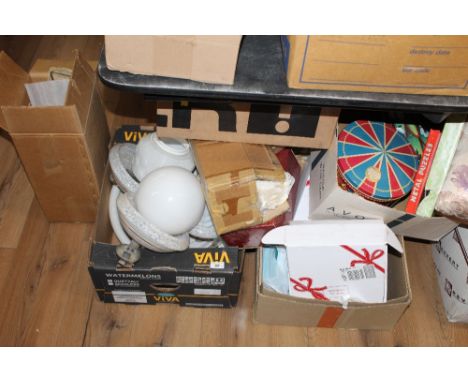 Four boxes of miscellaneous items to include lamp shades, rotating musical biscuit tin, puzzles, soft goods, CD's etc 