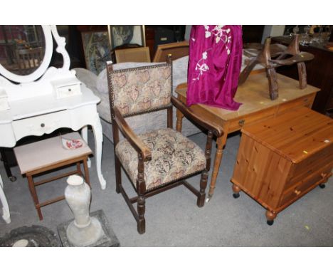 An oak open armchair upholstered in machine tapestry