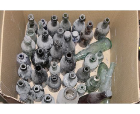 A box of various vintage and antique bottles to include one 18th century olive green bottle with high pontil kick and applied