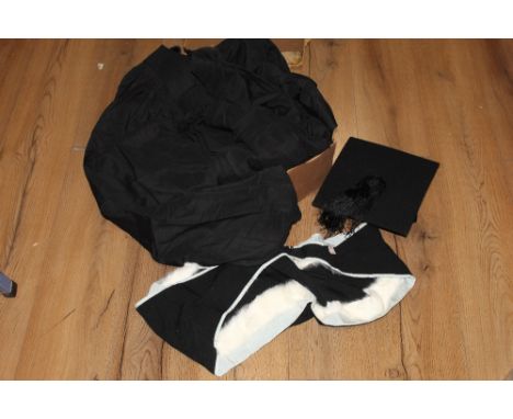 A vintage university gown, mortar board and fur trimmed sash 