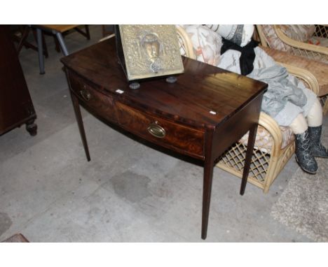 An Edwardian mahogany bow fronted side table with two drawers  