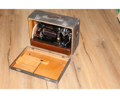 A vintage cased singer sewing machine, model number EL582503