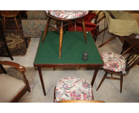 A vintage oak folding card table