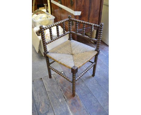 A 19th century bobbin turned corner chair. H: 68cm