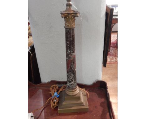 A late 19th / early 20th century Corinithian column brass and variegated marble table lamp. H: 58cm