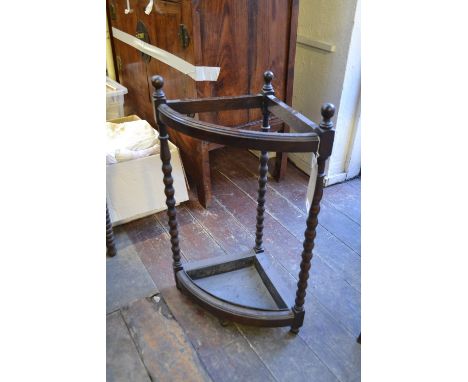 A Victorian umbrella stand, raised on bobbin turned supports. H: 70cm