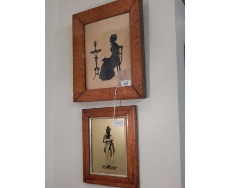 A late Victorian full length silhouette of a seated woman in formal gown, within maple frame. H.26cm W.21cm, together with on