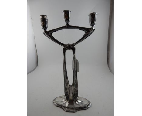 A white metal Art Nouveaux three sconce candle stick. H: 39cm