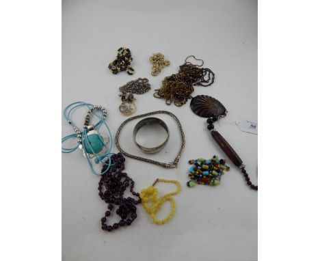 A quantity of costume jewellery, to include glass beads, a white metal bangle, necklaces, etc.