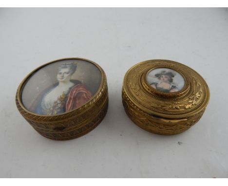 A late 19th / early 20th century French ormolu trinket box. the hinged cover decorated with palmettes, and set a circular hea