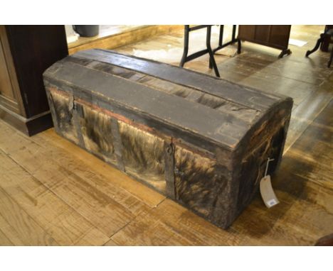 A late 19th century hide and iron bound trunk. W.103cm 