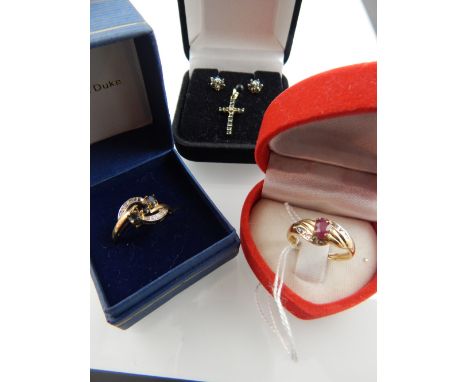 A yellow metal and ruby set ring, the shank stamped 375, together with a yellow metal and sapphire ring, a yellow metal and s