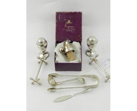 A pair of early 20th century silver pepperettes, hallmarked for London, together with a pair of silver knife rests, silver su