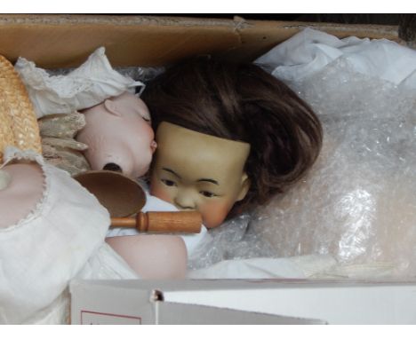 A collection of German and French bisque head dolls and accessories, including clothing, associated bodies etc.