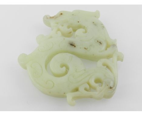 A Chinese jade pendant, in the form of a dragon. 