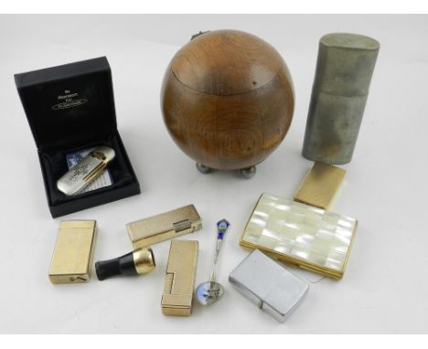 A 1930s Art Deco oak spherical tea caddy, together with various cigarette lighters, etc. 