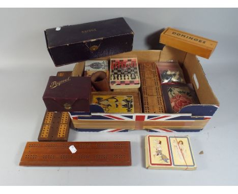 A Box of Games Including Risque Playing Cards, Cribbage Boards, Bridge Sets, Dominoes, Chess Set.