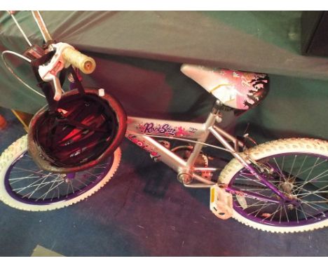 A Child's Rockstar Bicycle and Helmet.