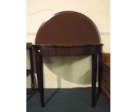 A 19th Century Demi Lune Lift Top Card Table with Brown Baize Playing Surface.