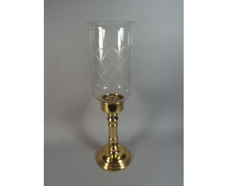 A Heavy Brass Candle Stick with Glass Shade.