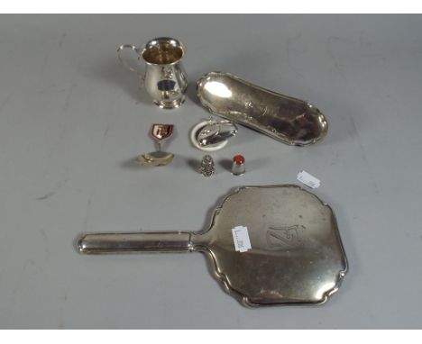 A Collection of Silver Items to Include Christening Mug 1932, Dressing Table Mirror and Brush, Teething Ring, Tea Caddy Spoon