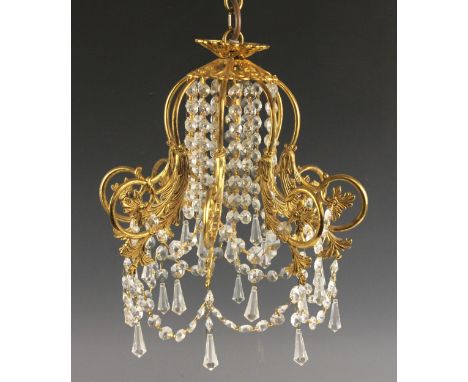 A gilt metal ceiling light, the eight scrolled foliate branches united by two rows of swagged droplets, 41cm high overall  Li