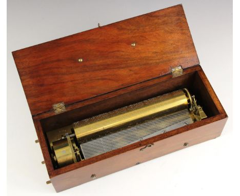 A mahogany cased music box, early 20th century, the hinged cover opening to a brass key wound cylinder movement with steel co