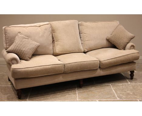 A Nova bespoke 'George' three seater sofa, early 21st century, upholstered in oatmeal coloured fabric, the padded scrolled ar