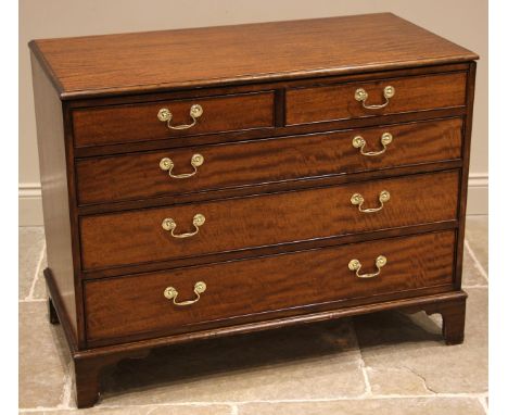 A George III style mahogany chest of drawers, late 20th century, formed with two short over three long  graduated and cock be