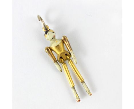 A 19th century style gold plated peg doll charm, the articulated limbs with enamel detail and associated bale, 4cm long, 2gms