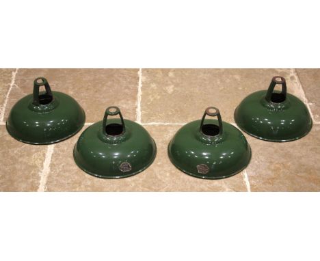 A set of four green enamelled 'Coolicon' light shades, mid 20th century, of dish form with a white interior, makers paper lab