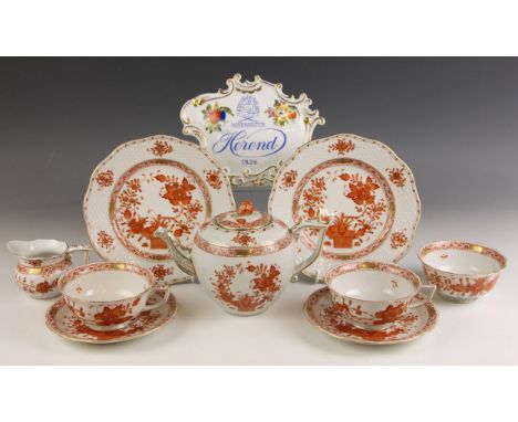 A Herend porcelain tete a tete tea service in the rust orange 'Indian Basket' pattern, comprising: a teapot and cover, a milk