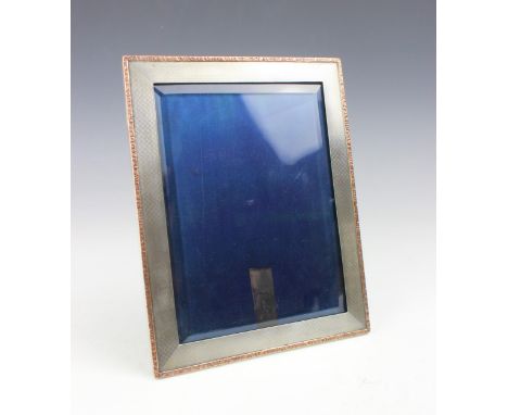 A George V silver photograph frame, possibly Colen Hewer Cheshire, Chester 1914, the rectangular engine turned detailed photo