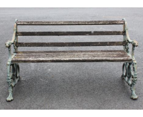 A Victorian Coalbrookdale style cast iron serpent and grape pattern garden bench, the painted cast serpent scroll ends extend