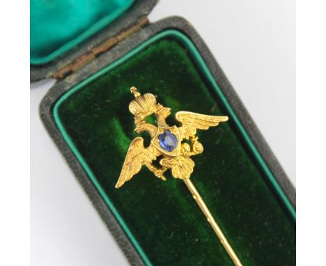 An early 20th century Russian untested sapphire set stick pin, possibly by Faberge, the central oval cut untested sapphire wi